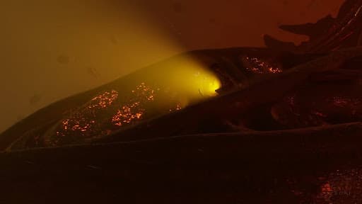 Thargoid Titan Raijin's interceptors leaving through its amber porthole 