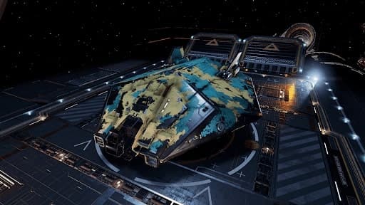 A screenshot of a teal and mustard damaged Asp Explorer landed on a fleet carrier