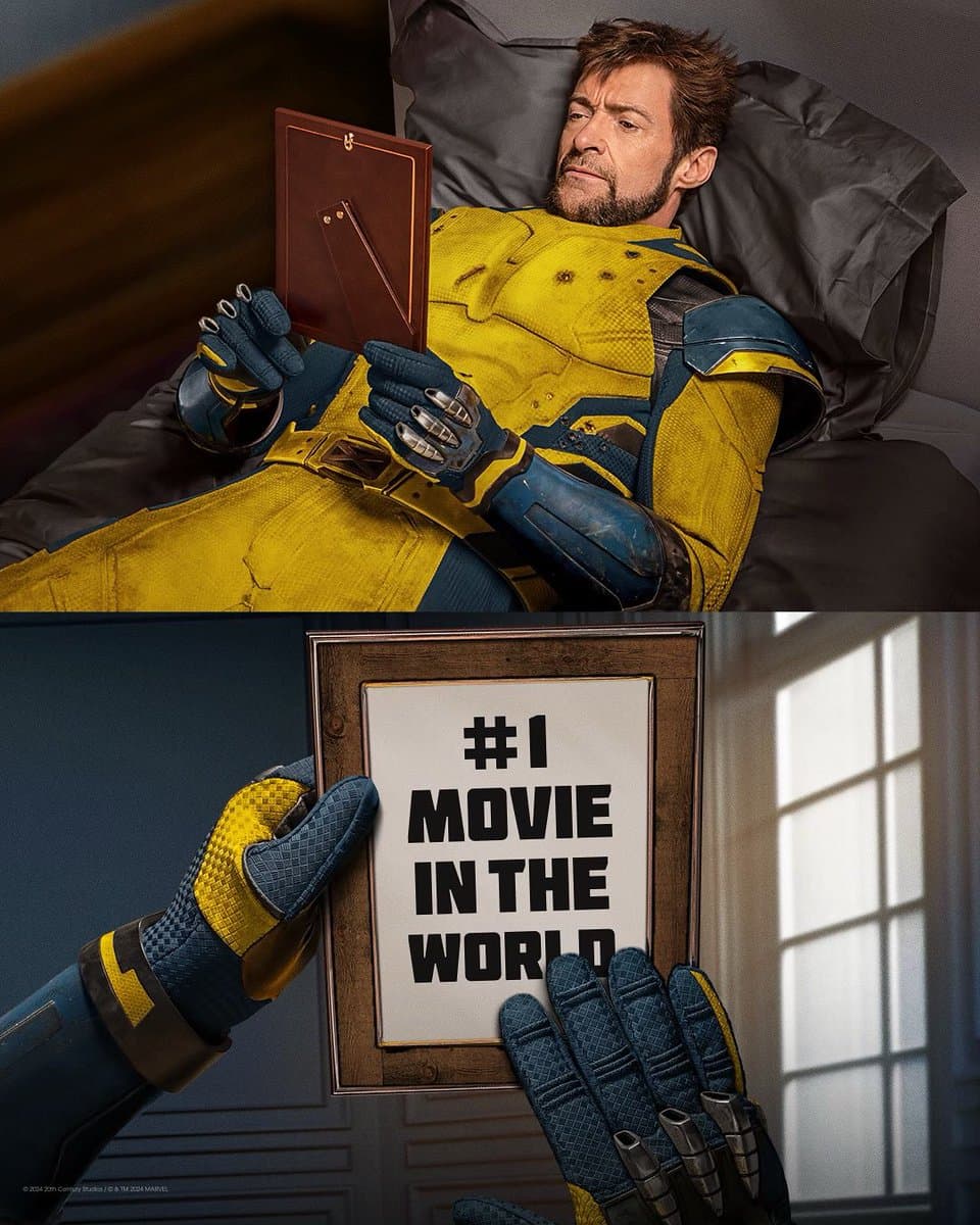 Picture of Hugh Jackman recreating the Wolverine meme of him looking longingly at a photo of Jean Gray. Instead the photo features the words "#1 movie in the world".