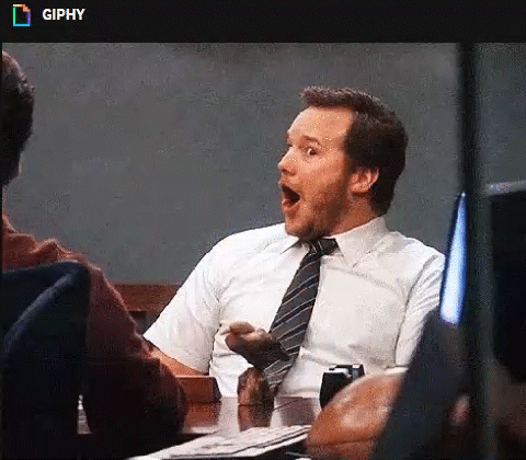 Gif of Andy from Parks and Recreation turning to the camera with a shocked but excited expression on his face